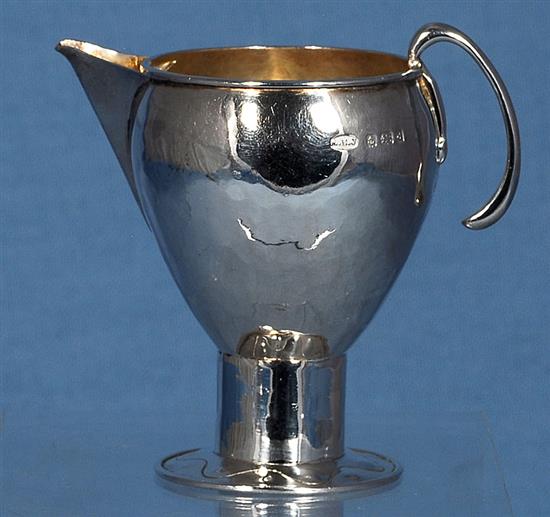 An Edwardian Arts & Crafts silver sparrow beak cream jug, Height 3 ¾”/90mm Weight 2.8oz/80grms